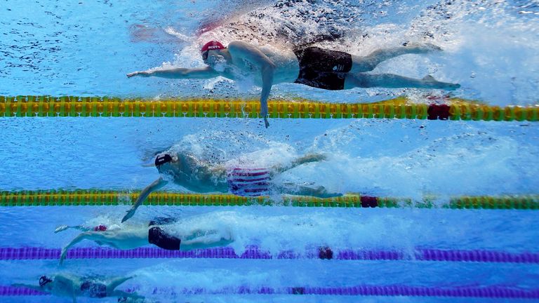 Britain's Scott (top) swims towards his silver medal triumph