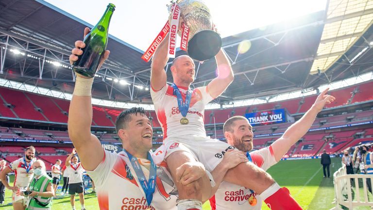 James Roby, Louie McCarthy-Scarsbrook and Kyle Amor celebrate with St Helens' fans