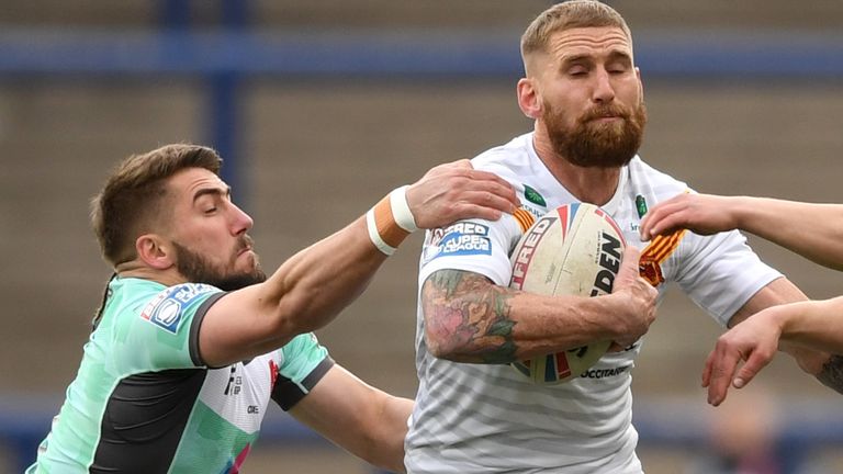 Sam Tomkins of Calalans is tackled during March's victory over Hull KR