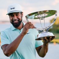 Tony Finau poses with The Northern Trust trophy