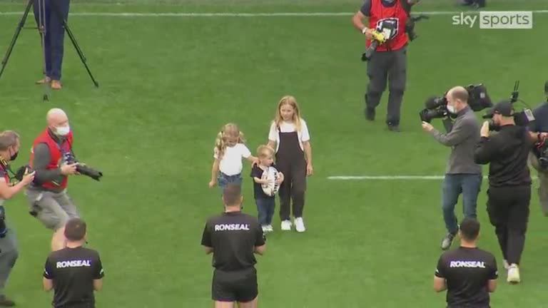 The three children of Leeds Rhinos legend Rob Burrow present the match ball to referee Ben Thaler ahead of the game against Huddersfield at Headingley.