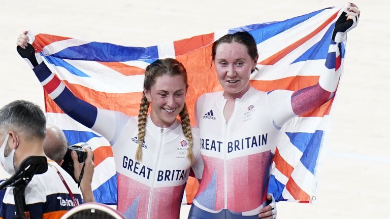 Katie Archibald and Laura Kenny celebrate winning their gold medal in the women's Madison