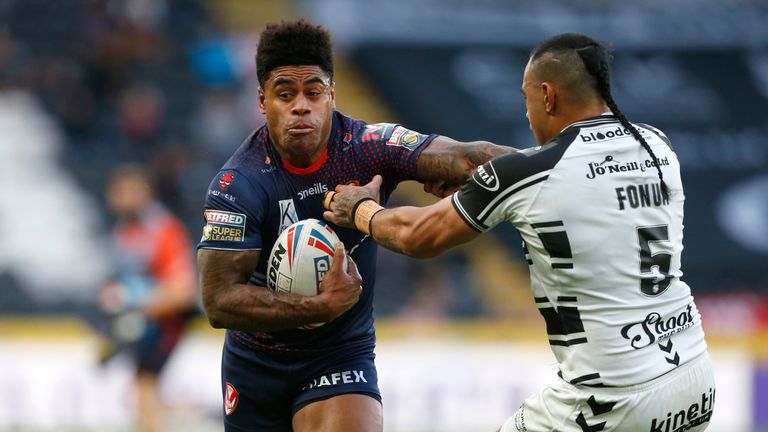 St Helens' Kevin Naiqama and Hull FC's Mane Fonua in action
