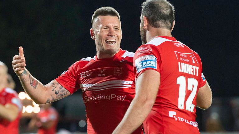 Shaun Kenny-Dowall celebrates victory over Wigan with Kane Linnett