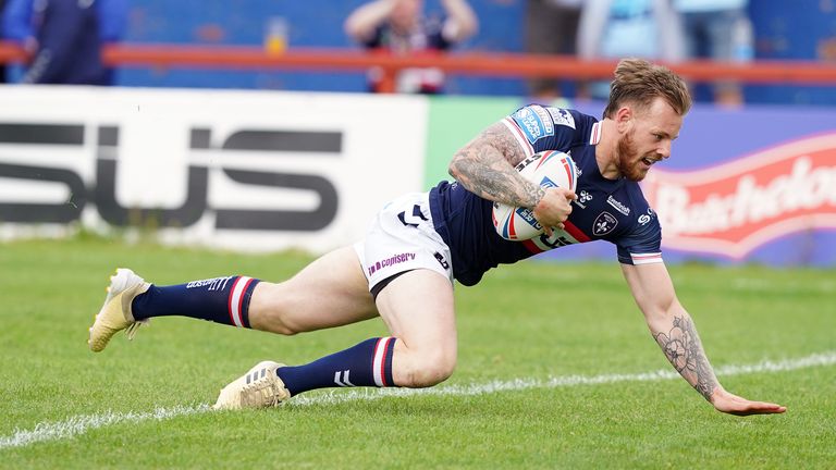 Tom Johnstone dives over for Wakefield's first try