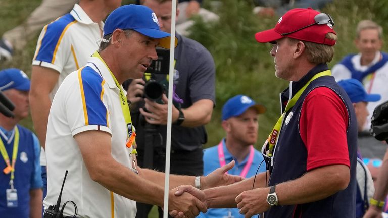 Steve Stricker is congratulated by Padraig Harrington after Team USA romped to victory