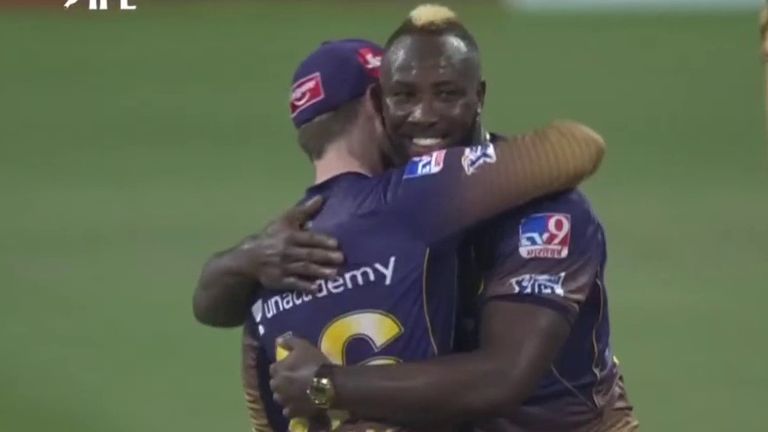 Kolkata Knight Riders' Andre Russell hugs captain Eoin Morgan after yorking AB de Villiers for a duck