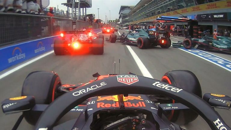 There's almost a pile up in the pitlane as several cars almost collide, while an Alpine mechanic is nearly knocked over!