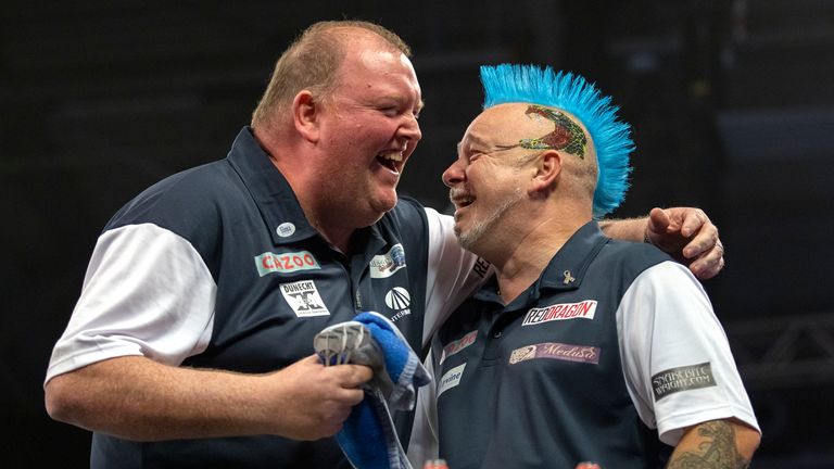 John Henderson and Peter Wright claimed the World Cup for Scotland