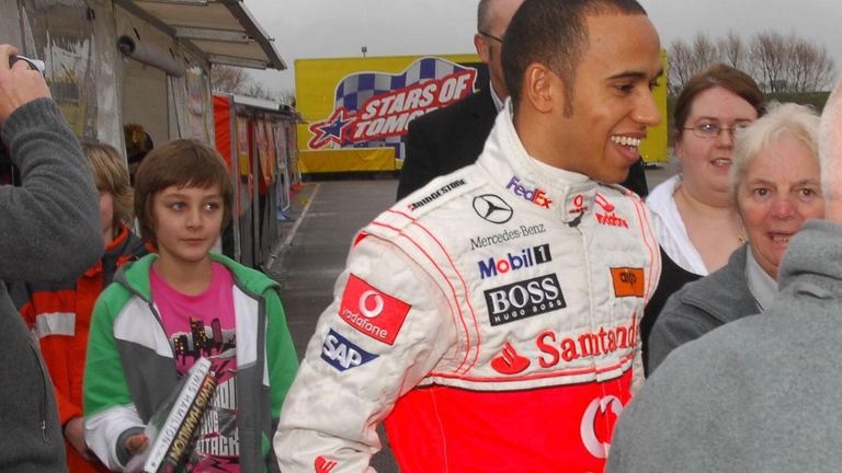 George Russell, then 11, hunts an autograph from Lewis Hamilton, then 24 and off the back of his maiden F1 title, at a Formula Kart Stars event in 2009
