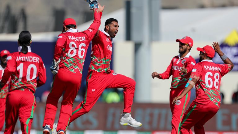 Oman paceman Kaleemullah celebrates an early wicket