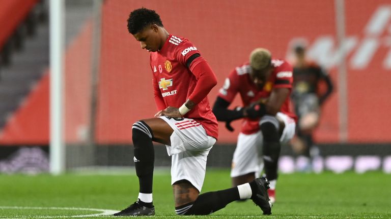 Manchester United's Marcus Rashford takes a knee at Old Trafford last year
