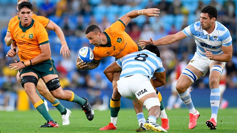 Quade Cooper looks to offload out of the tackle