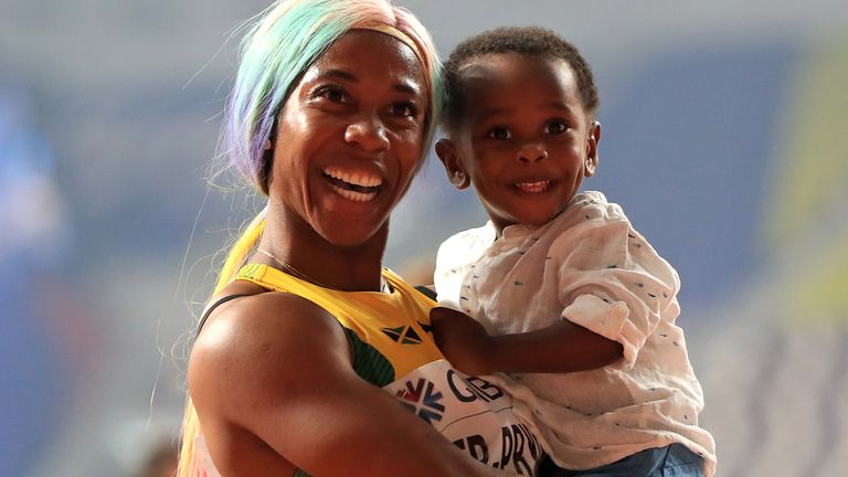 Shelly-Ann Fraser-Pryce poses on the track with her four-year-old son Zyon
