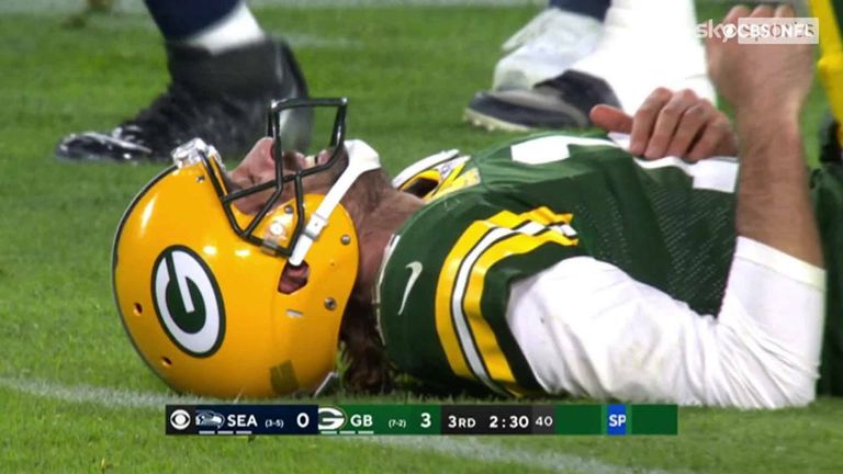 Watch as Russell Wilson and Aaron Rodgers throw interceptions in the endzone during the third quarter.