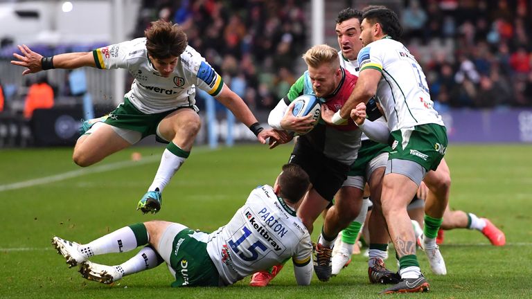 Harlequins' Tyrone Green is brought down by the London Irish defence