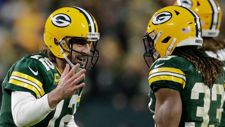 Aaron Rodgers and Aaron Jones celebrate one of the running back's two third quarter touchdowns for Green Bay