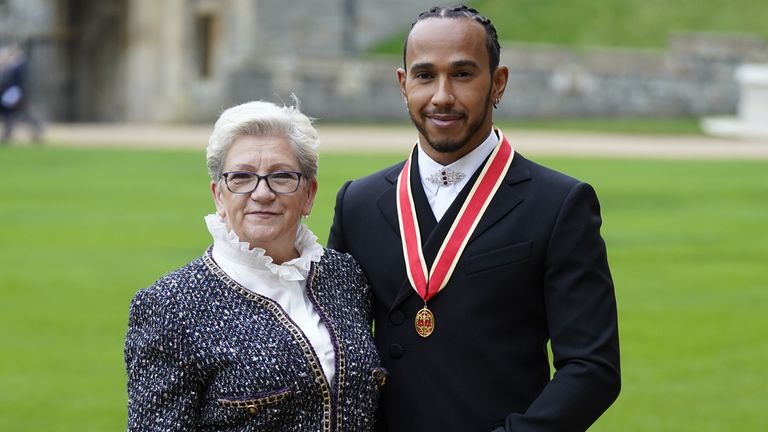 Sir Lewis Hamilton with his mother Carmen Lockhart after he was made a Knight Bachelor by the Prince of Wales