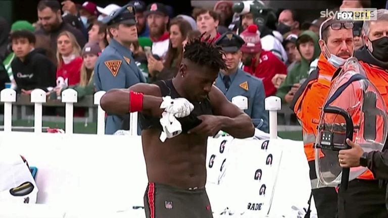 Watch Antonio Brown's final act for the Tampa Bay Buccaneers as he took off his jersey and threw it into the stands while walking out midway through a game.