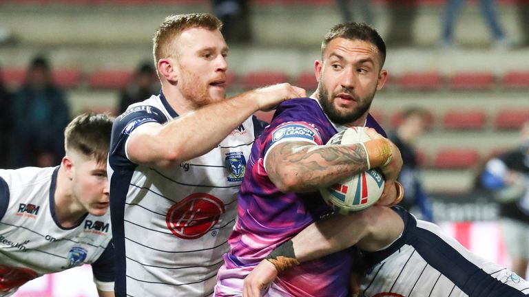 Toulouse try-scorer Romain Navarrete is tackled by Warrington's Jack Hughes