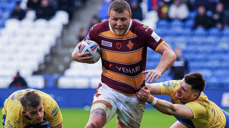 Josh Jones escapes the tackle of Hull KR&#8217;s Sam Wood and Jez Litten