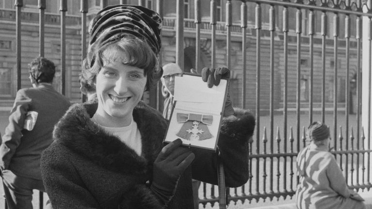 Hyman with her MBE outside Buckingham Palace in November, 1965