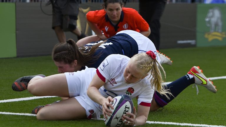 Heather Cowell crosses for England's third try in the corner 