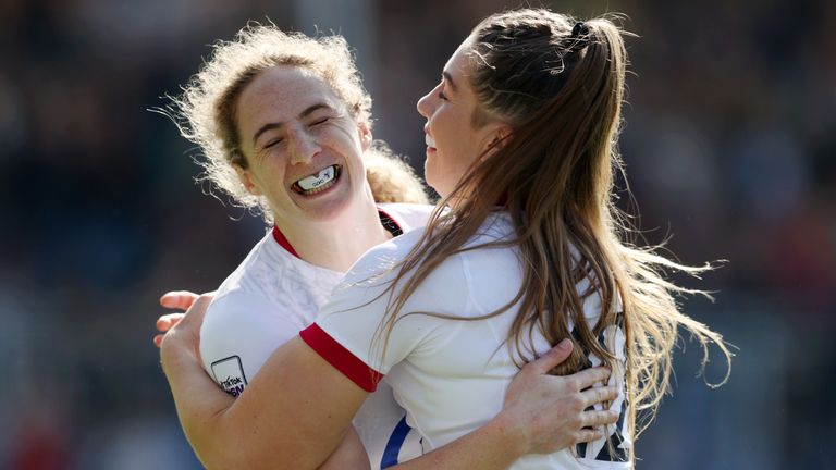Abby Dow celebrates with team-mate Holly Aitchison in England's heavy Women's Six Nations defeat of Scotland 