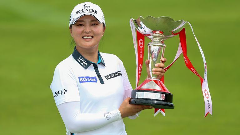 Jin-Young Ko of South Korea holds the championship trophy after winning the Women's World Championship at Sentosa Golf Club in Singapore