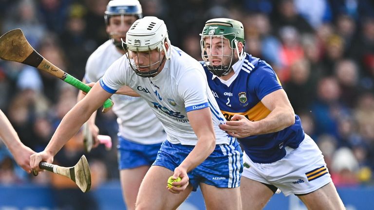 Waterford's Neil Montgomery is tackled by Cathal Barrett of Tipperary