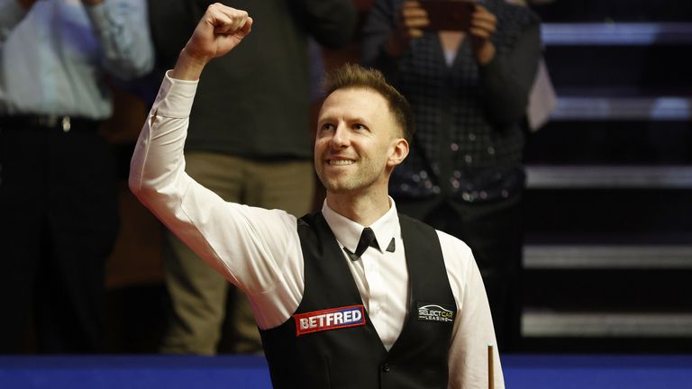 Judd Trump celebrates his epic victory over Mark Williams