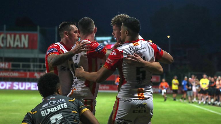  Matthieu..Laguerre of Catalans Dragons celebrates with his teammates after scoring a try
