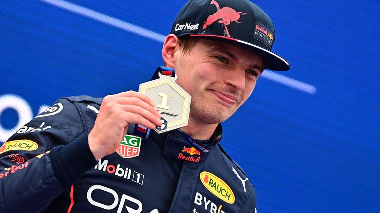 Max Verstappen celebrates winning the first spring race of the 2022 season at Imola