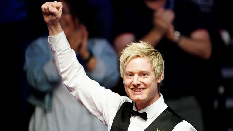 Neil Robertson celebrates making a 147 against Jack Lisowski at The Crucible in Sheffield