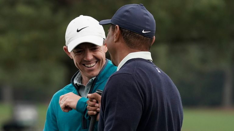 Tiger Woods and Rory McIlroy share a conversation as they both practice at Augusta ahead of this week's Masters
