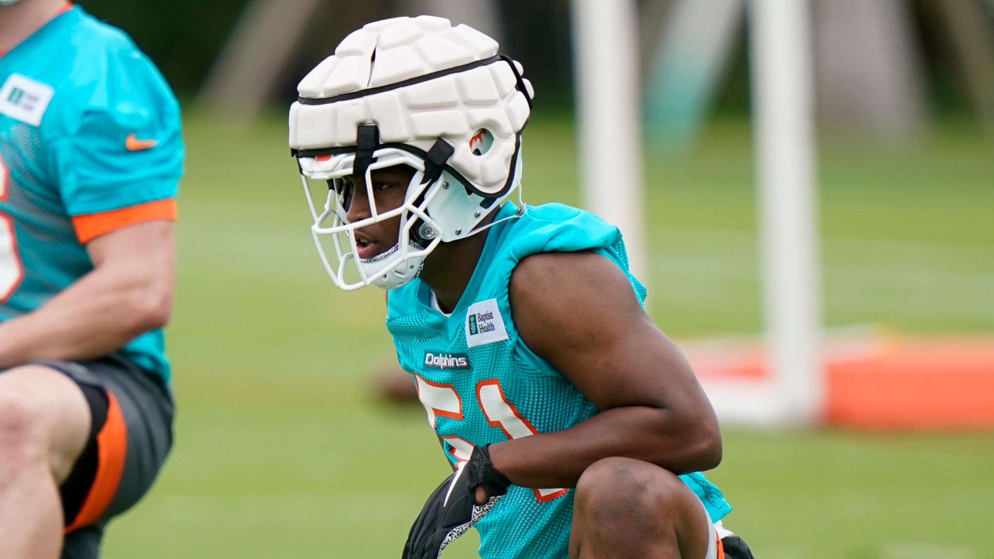 Miami Dolphins rookie linebacker Channing Tindall flies around