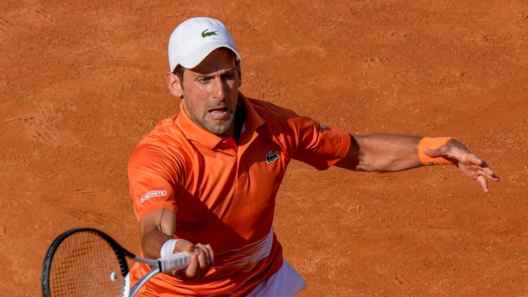 Novak Djokovic returns the ball during his second-round win over Aslan Karatsev at the Italian Open