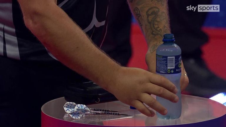 Price was seen placing his water bottle very specifically on the table at the start of the match against Martin Schindler