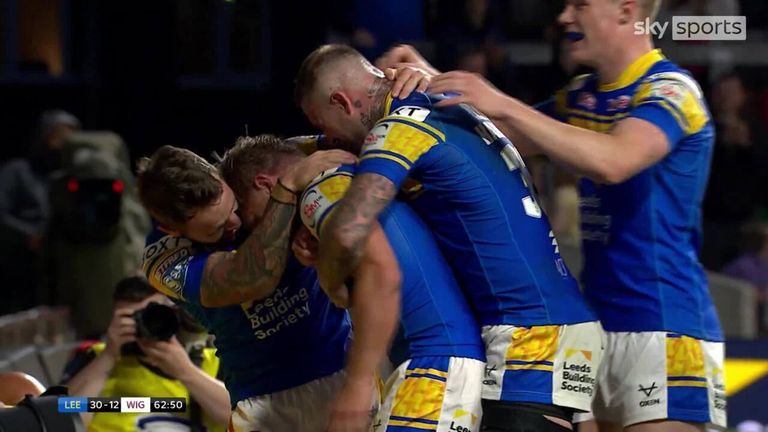 Leeds' Brad Dwyer goes solo as his try gives the Rhinos a 36-12 lead over Wigan.