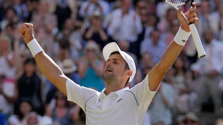 Djokovic celebrates after securing his fourth Wimbledon title in a row