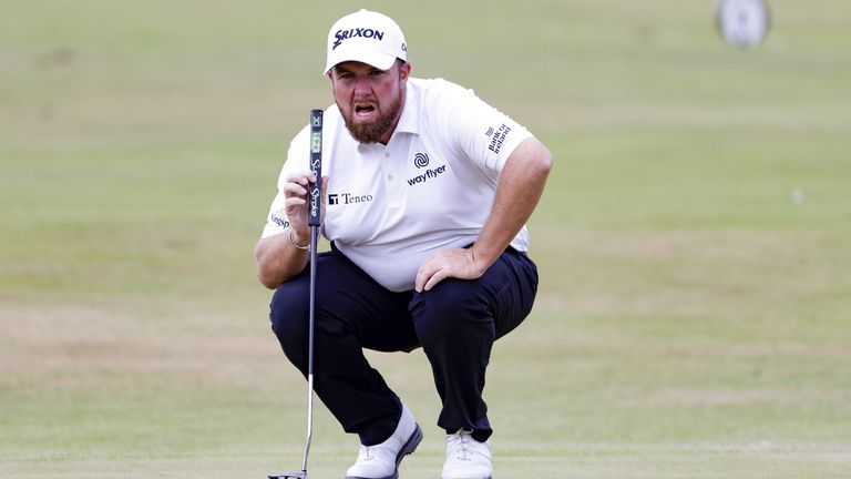 Shane Lowry lines up his putt at 18 on day three of The Open