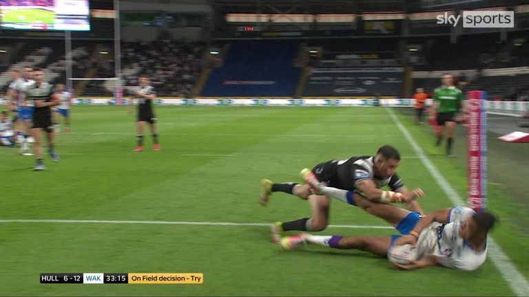 Lewis Murphy scores a controversial try to extend Wakefield Trinity's lead against Hull FC.