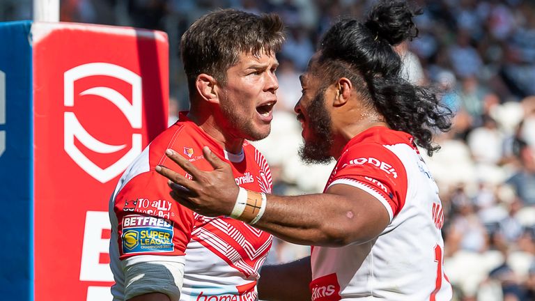 Louie McCarthy-Scarsbrook is congratulated as he tries second for St Helens against Hull FC