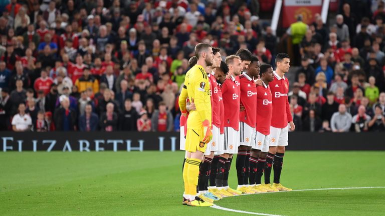 Manchester United's players and supporters during their minute's silence before their tie against Real Sociedad