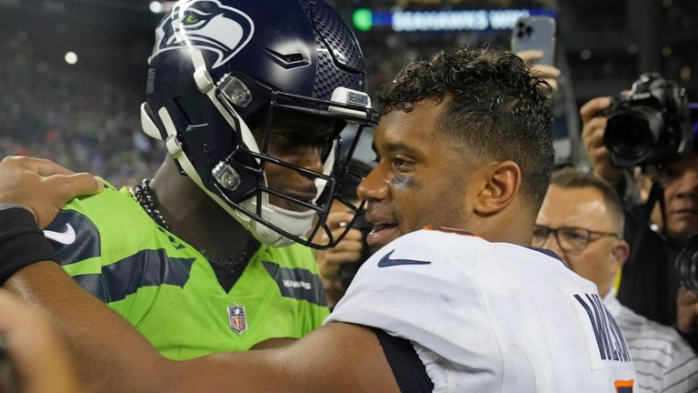 Seattle Seahawks quarterback Jeno Smith with former teammate Russell Wilson at the end of the match