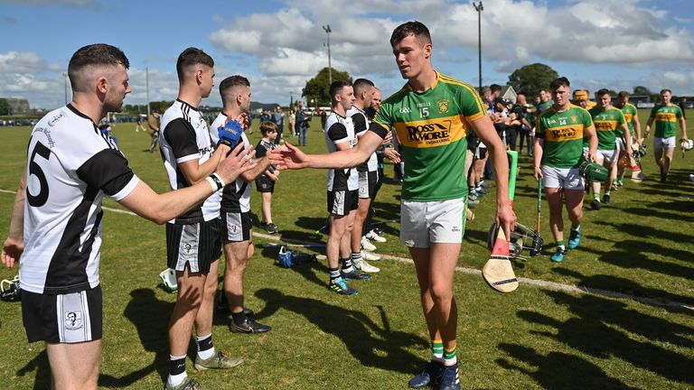 Kilruane MacDonaghs give their opponents a guard of honour after the match