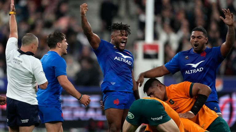 French players celebrate a stunning win at the final whistle