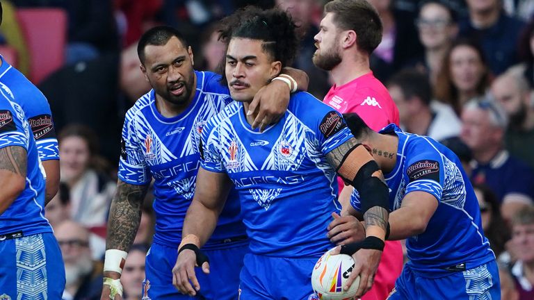 Samoa congratulate Tim Lafai on the opening try