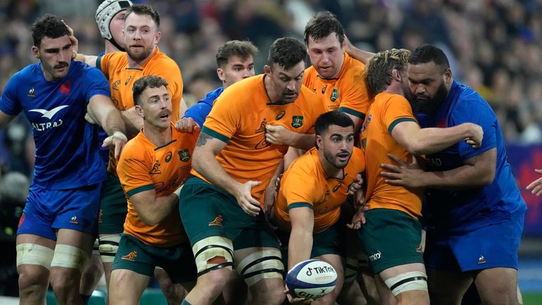 Australia's Tom Wright reaches out to pass the ball from a maul