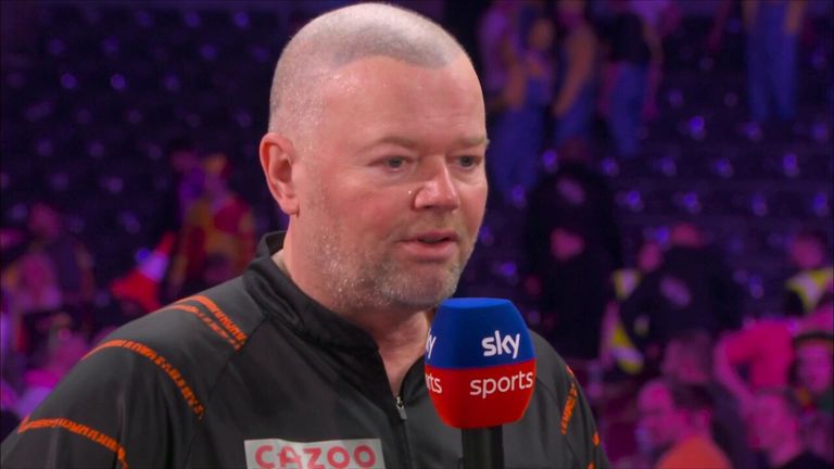 Raymond van Barneveld reacts to his second round win against Ryan Meikle at the 2023 World Darts Championship.